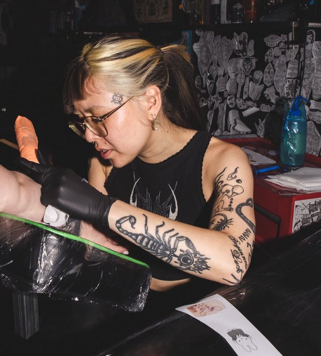Chalida tattooing at 13 Feet Tattoo, Sydney