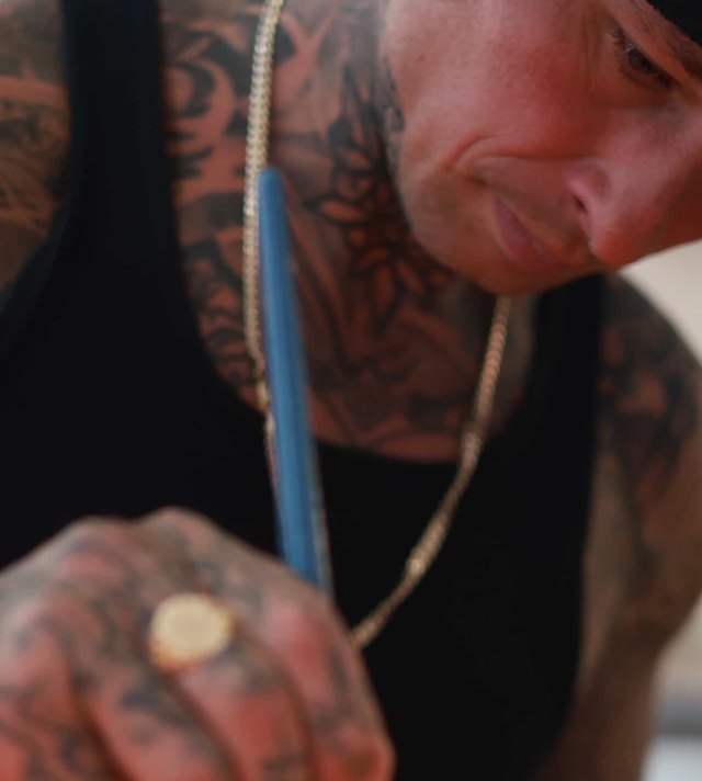 Josh Marx painting at Prana Tattoo