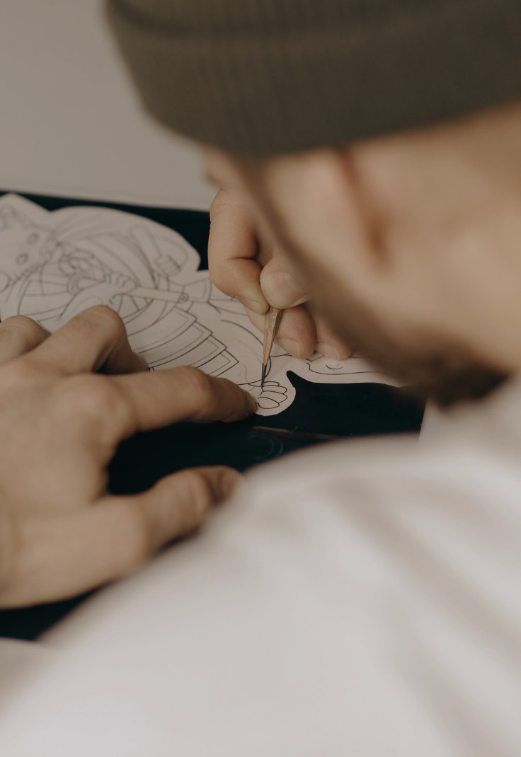 Tattoo artist drawing a design